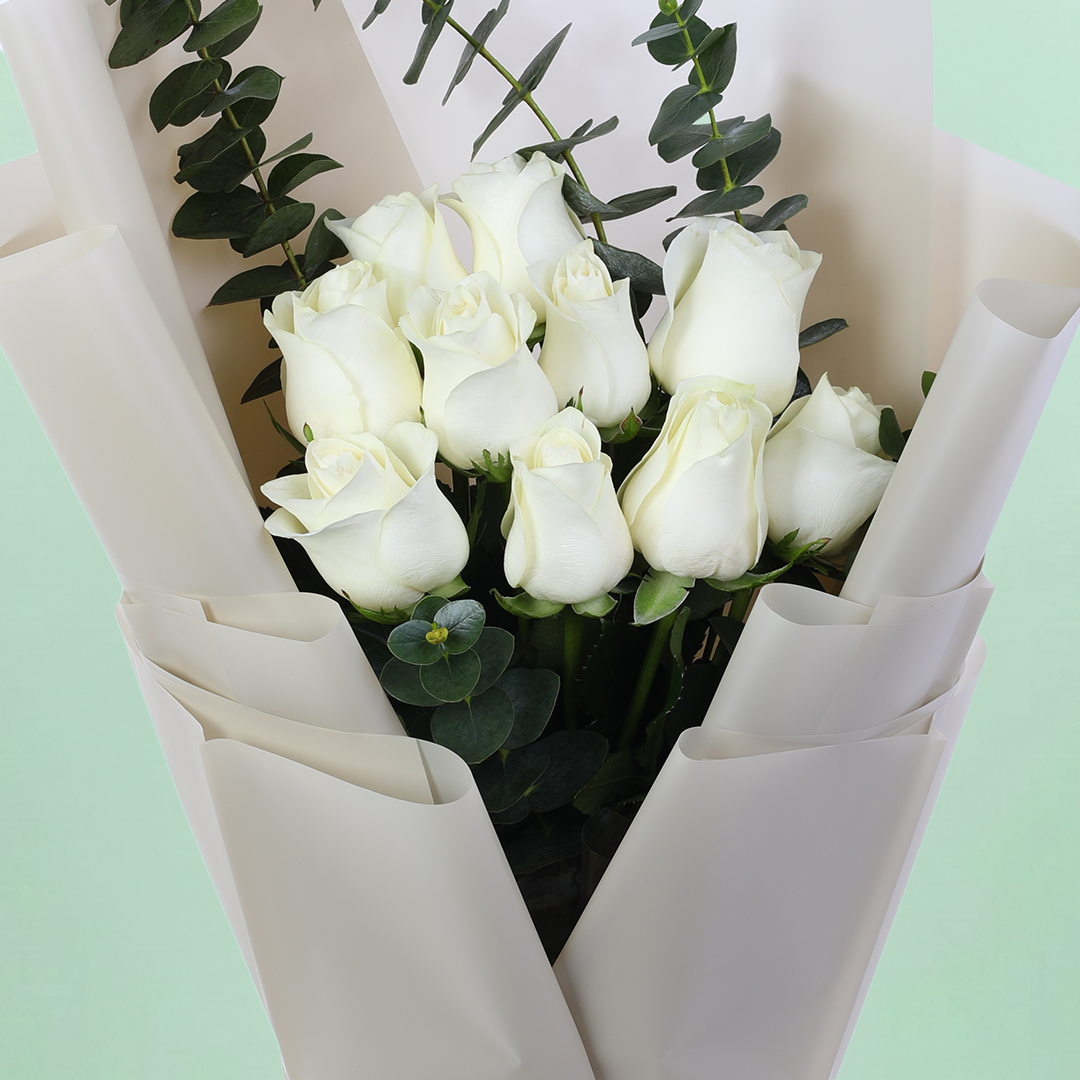 10 White Rose Eucalyptus Bouquet arranged with 10 white roses and eucalyptus