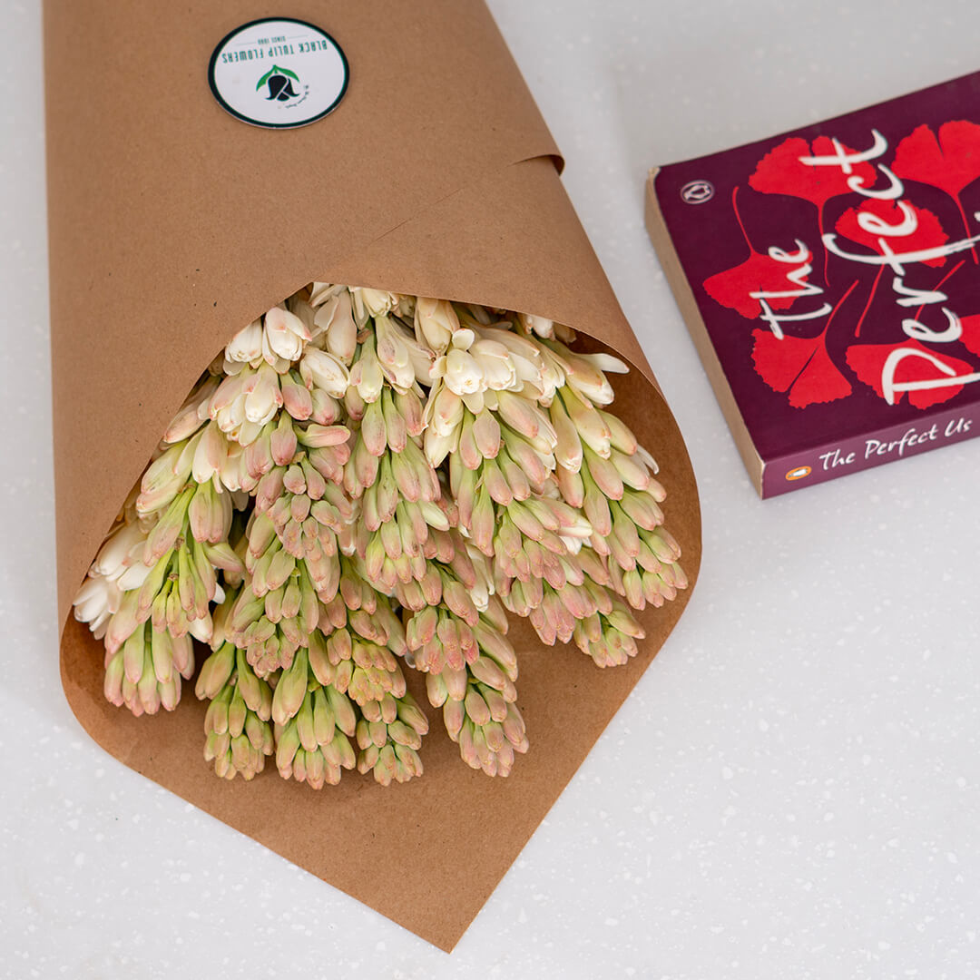 White Tuberose cut flowers featuring delicate, clustered blooms wrapped in a brown sheet