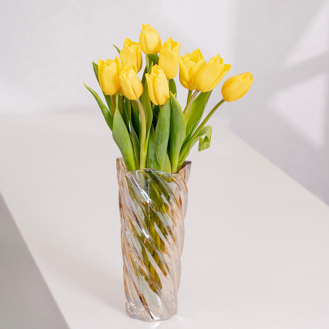 Fresh yellow cut tulip flowers with bright golden petals in a spring bouquet