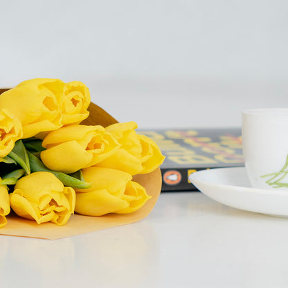 Fresh yellow cut tulip flowers with bright golden petals in a spring bouquet