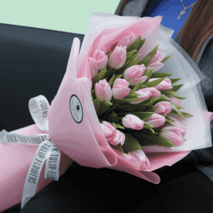 Elegant 20 light pink tulips bouquet wrapped in soft pink tissue floral wrap