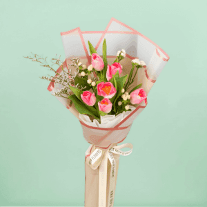 Small 6 pink tulips bouquet with berry accents wrapped in cellophane