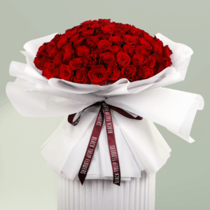Heartfelt bouquet of red roses tied with a satin ribbon.