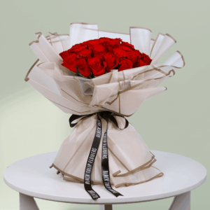 A bouquet of vibrant red roses wrapped beautifully for Valentine's Day. Order red rose bouquet
