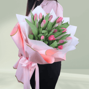 A vibrant bouquet of 15 pink tulip stems, available for online purchase.