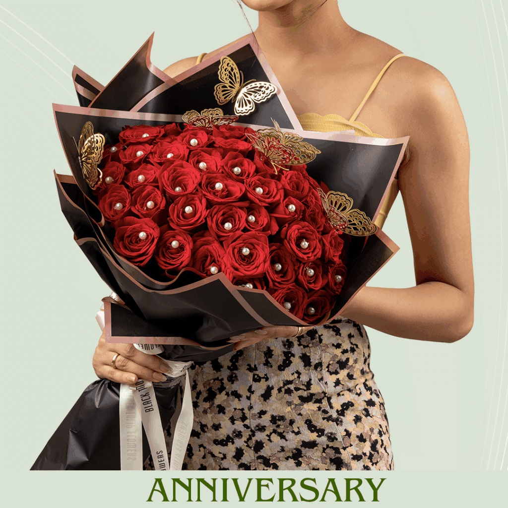 Anniversary Flowers - Red roses in black wrapped bouquet