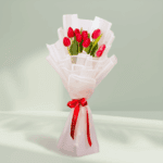 10 red tulips bouquet wrapped in white Korean flower paper with red satin ribbon