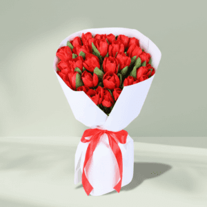 "A vibrant bouquet of 30 red tulips, elegantly wrapped in soft non-woven paper"
